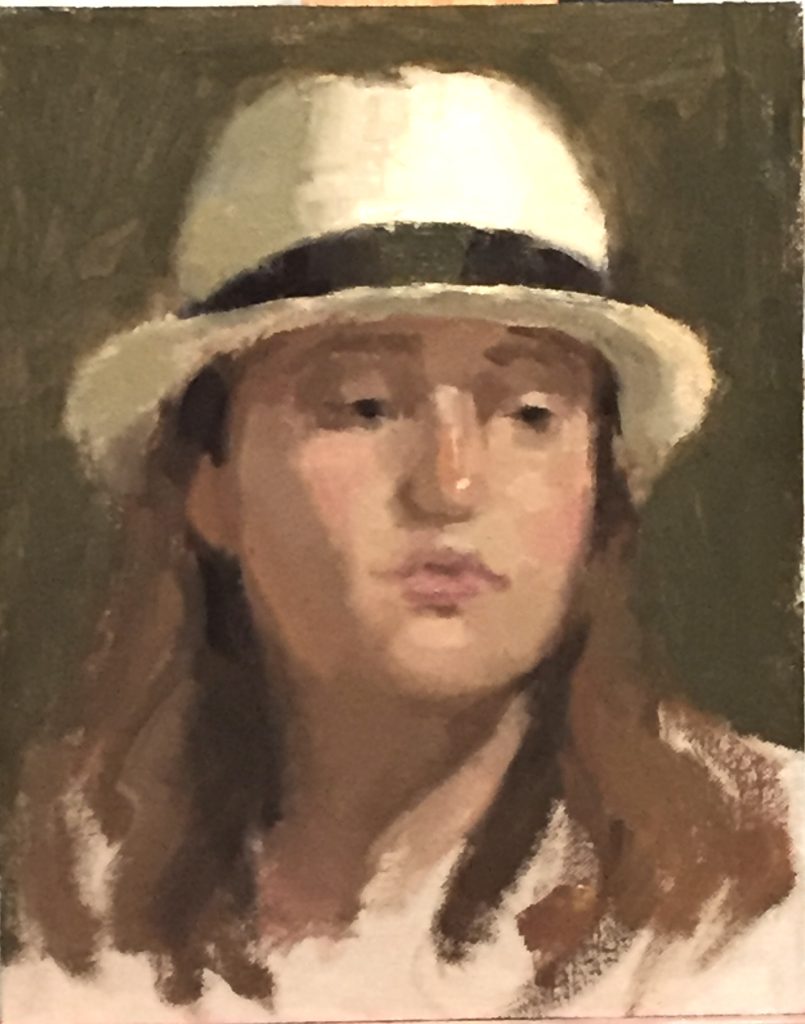 Joelle with Hat portrait of young woman wearing straw hat
