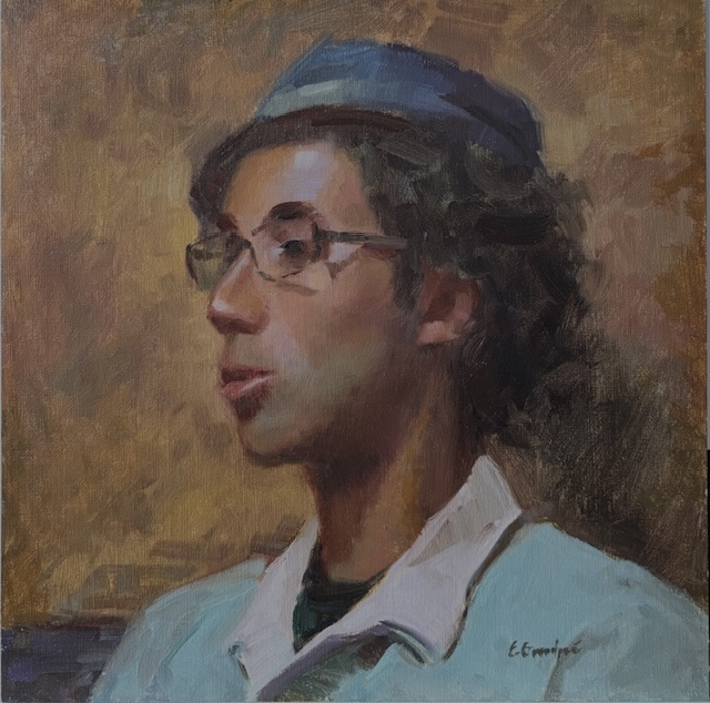 Esey Portrait of young man with dark curly hair, glasses and a cap