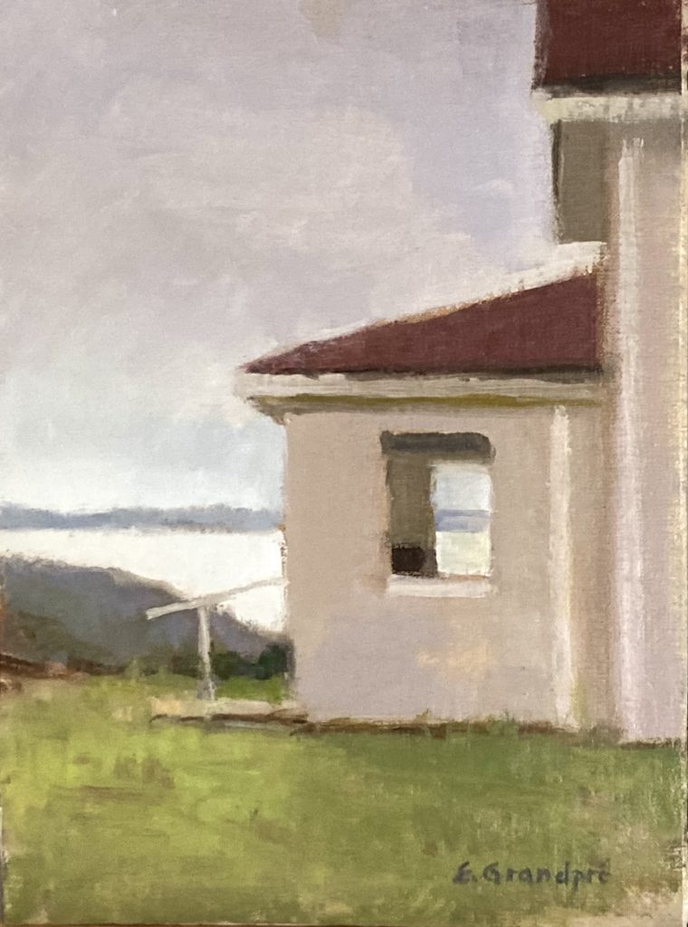 Cool light, end of day View of side of building overlooking ocean and distant land, overcast light